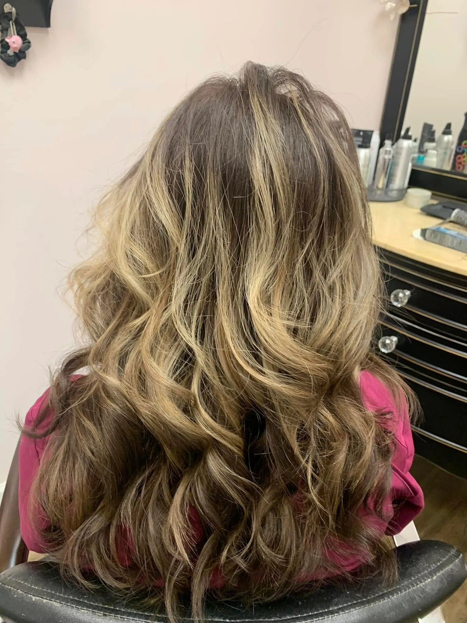 Hand-painted dimensional hair color styled at Miracles Salon & Spa in Shallotte, North Carolina