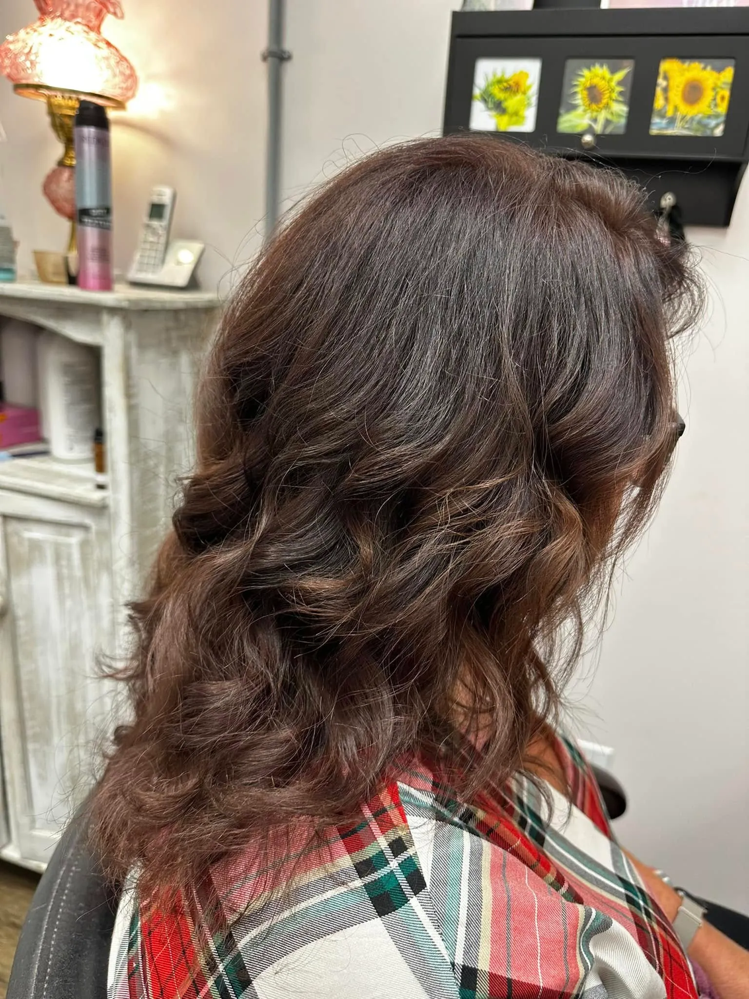 Defined, healthy curls styled at Miracles Salon & Spa