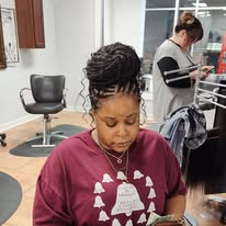 Braided updo protective style at Miracles Salon & Spa in Shallotte, NC
