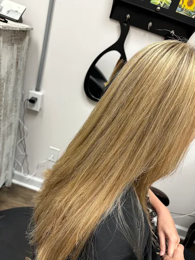 Sleek blonde highlights, side view, at Miracles Salon & Spa in Shallotte, NC