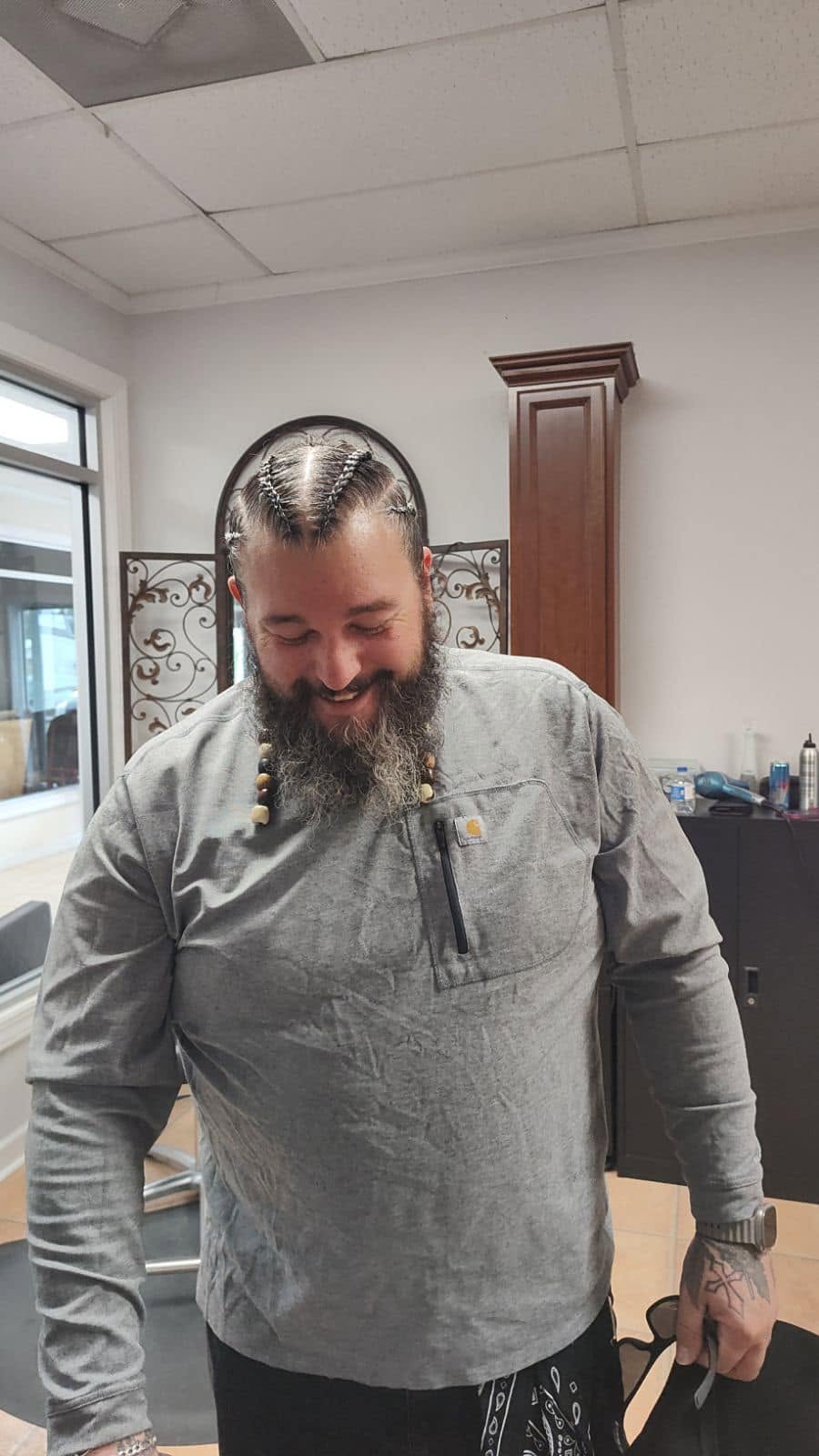 Men's braided top-knot with beaded beard braids at Miracles Salon & Spa in Shallotte, NC