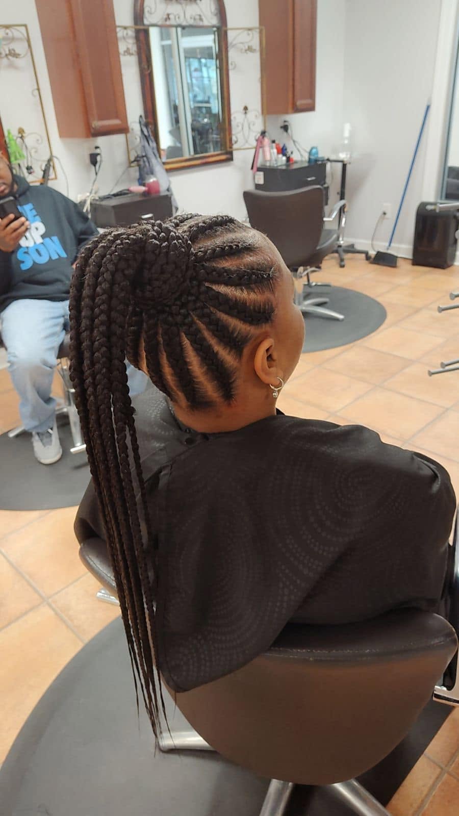 Feed-in cornrows into a braided ponytail at Miracles Salon & Spa in Shallotte, NC