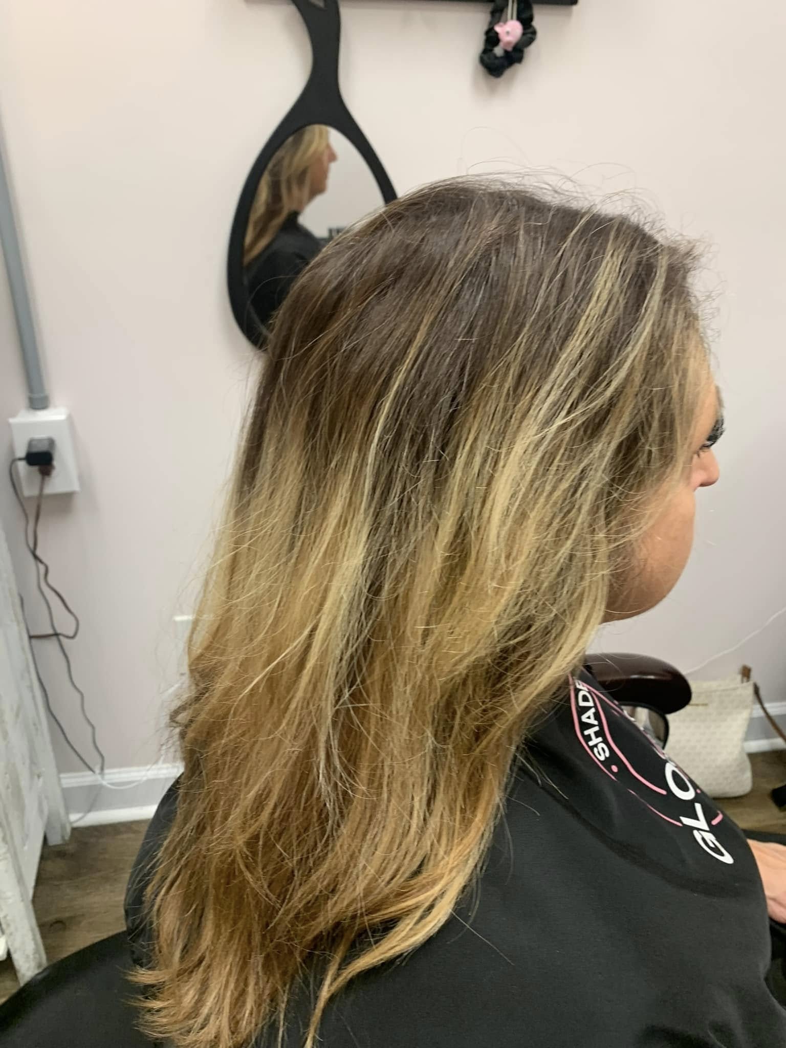 Lived-in blonde balayage, side view, at Miracles Salon & Spa in Shallotte, NC