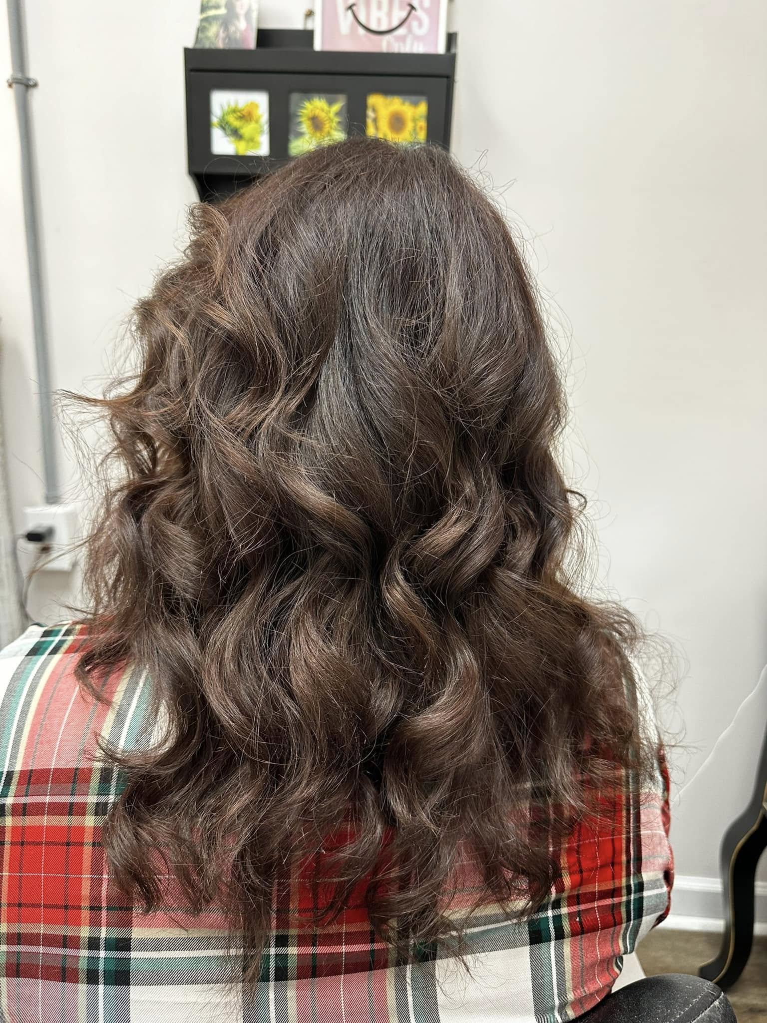 Voluminous brunette curls at Miracles Salon & Spa in Shallotte, NC