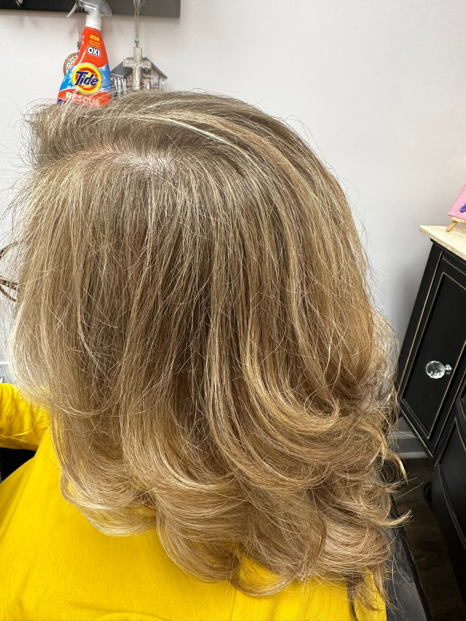 Warm blonde color with a curled blowout at Miracles Salon & Spa in Shallotte, NC