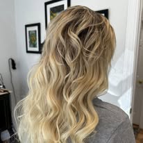 Beachy blonde balayage, back view, at Miracles Salon & Spa in Shallotte, NC