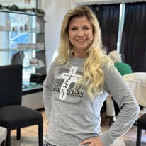 Guest showing off long blonde waves at Miracles Salon & Spa in Shallotte, NC